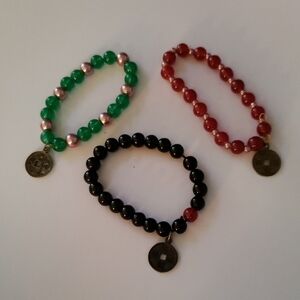 Set of Three Beaded Bracelets with Charms